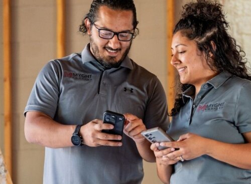 Construction service providers using software on their mobile device to manage business operations