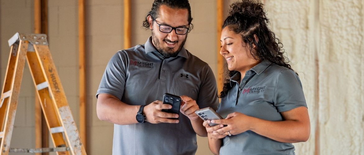 Construction service providers using software on their mobile device to manage business operations