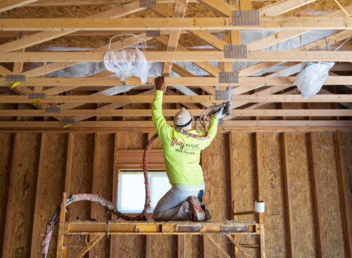 image of roofer on scaffolding