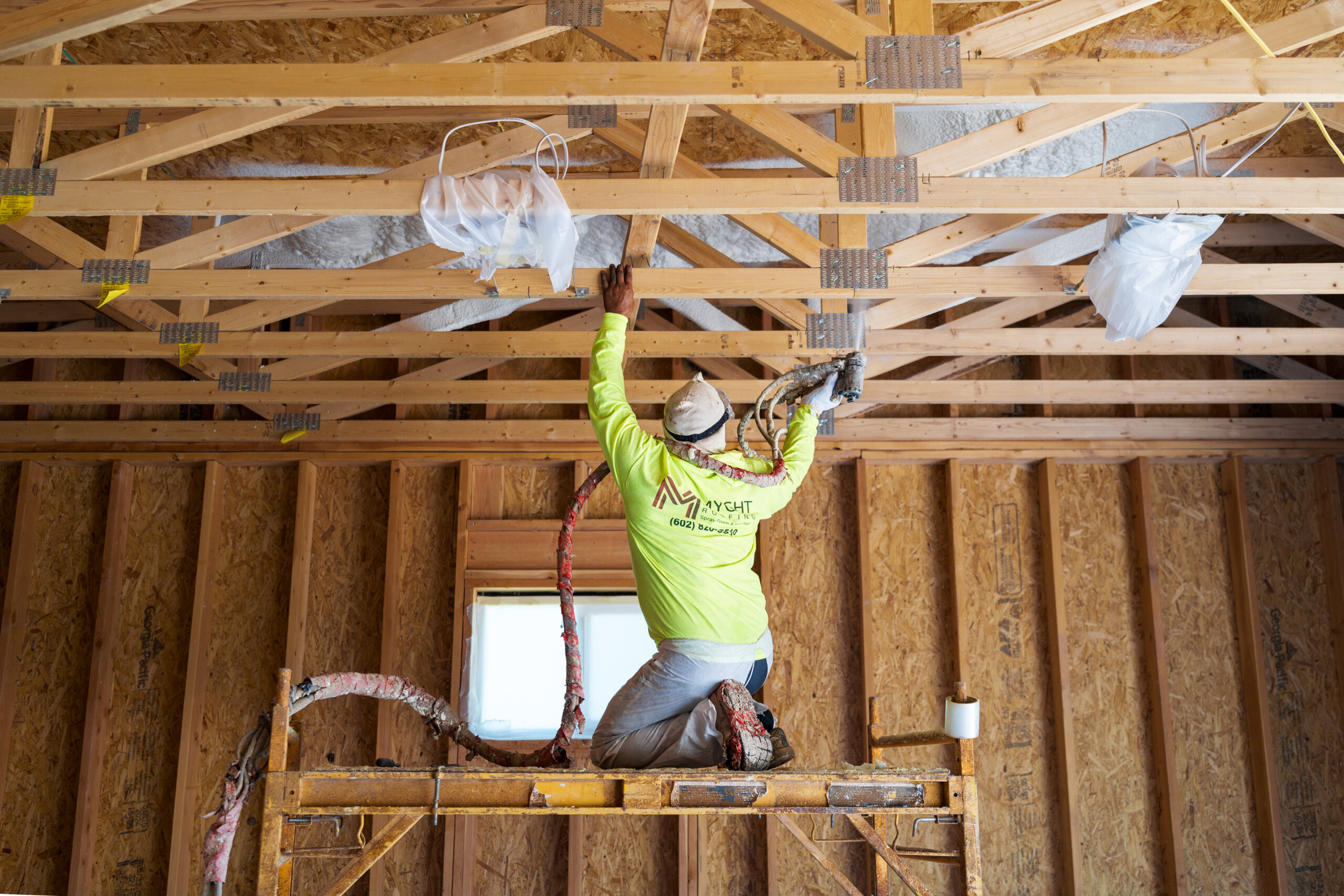 image of roofer on scaffolding