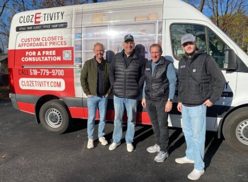 Clozetivity franchise team standing together, representing operational scale across Home Based Franchise Group brands.