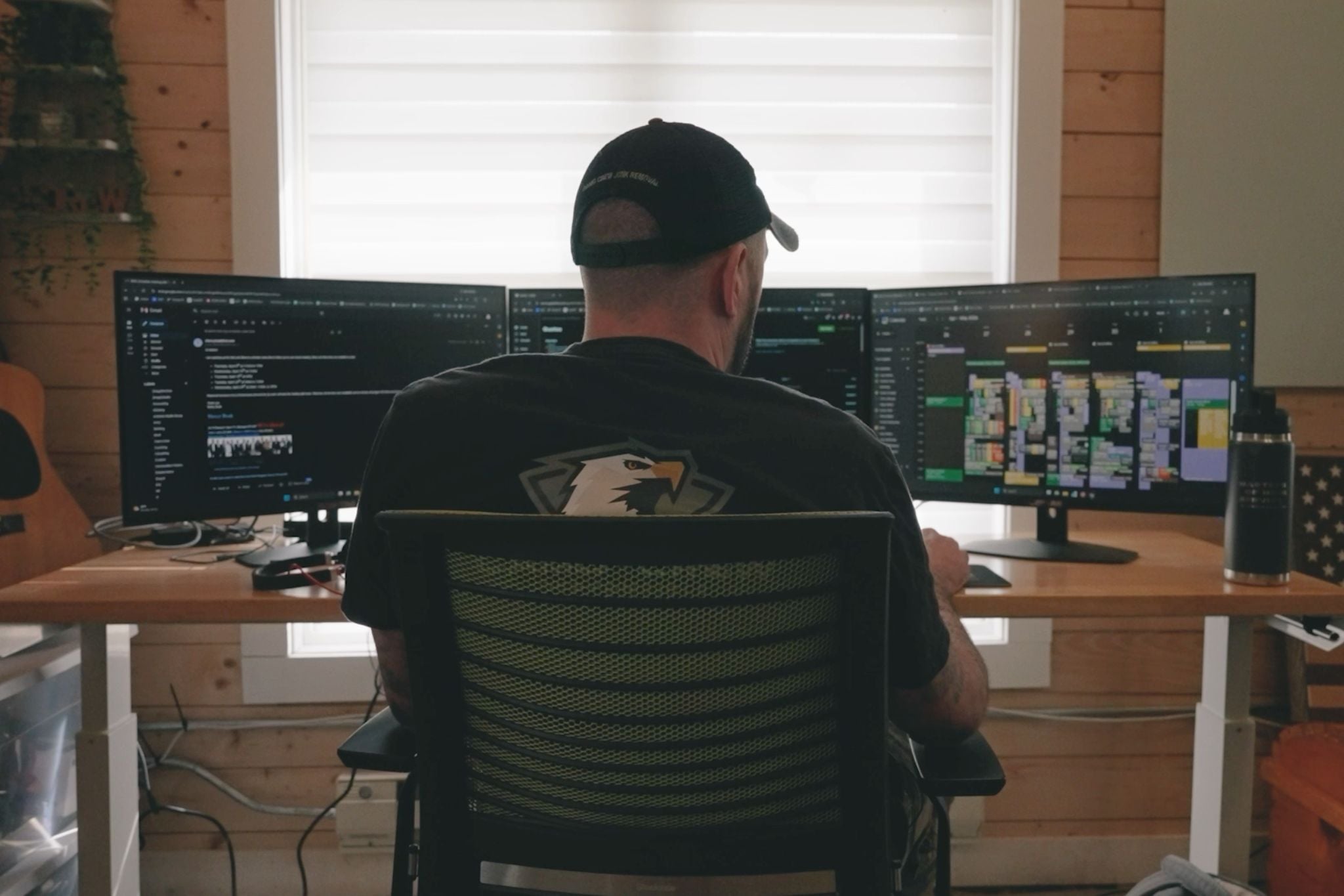 Camo Crew Responsible Junk Removal owner managing operations from a workspace displaying scheduling and Jobber software.