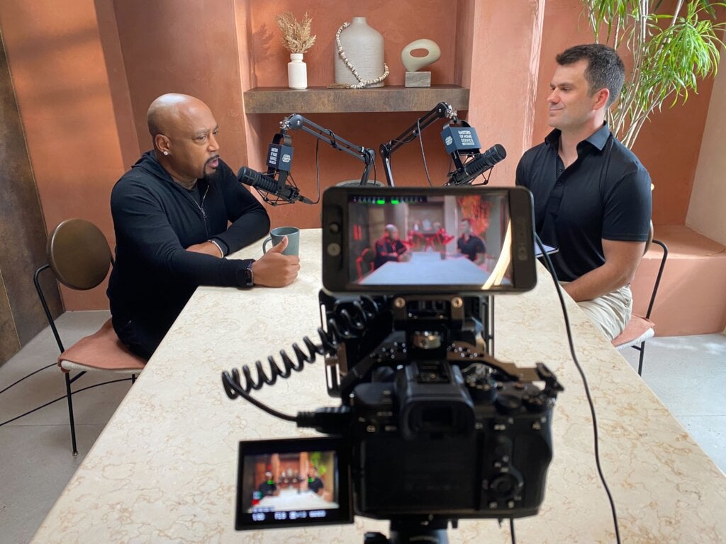 Daymond John, FUBU founder and Shark Tank investor, with Masters of Home Service host Adam Sylvester in Miami.