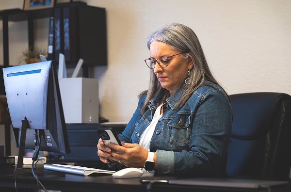 A woman sitting at a computer